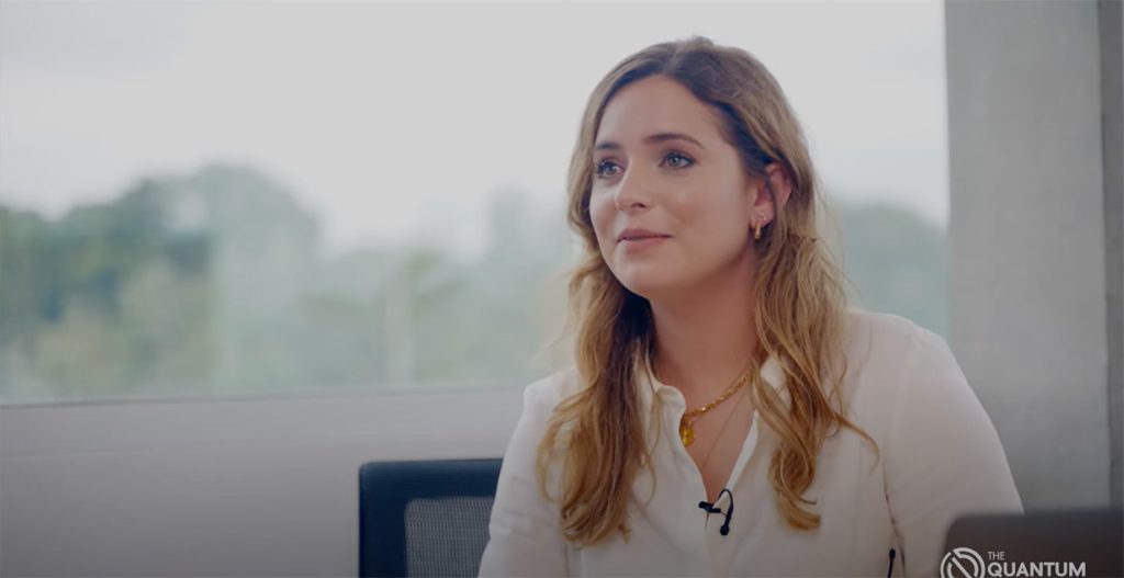 Ilana sat in a chair being interview for The Quantum Insider
