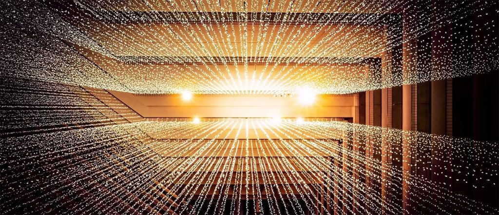 Thousands of tiny lights dropping from a ceiling